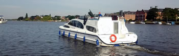 Norfolk Broads hire boat heads out onto Oulton Broad